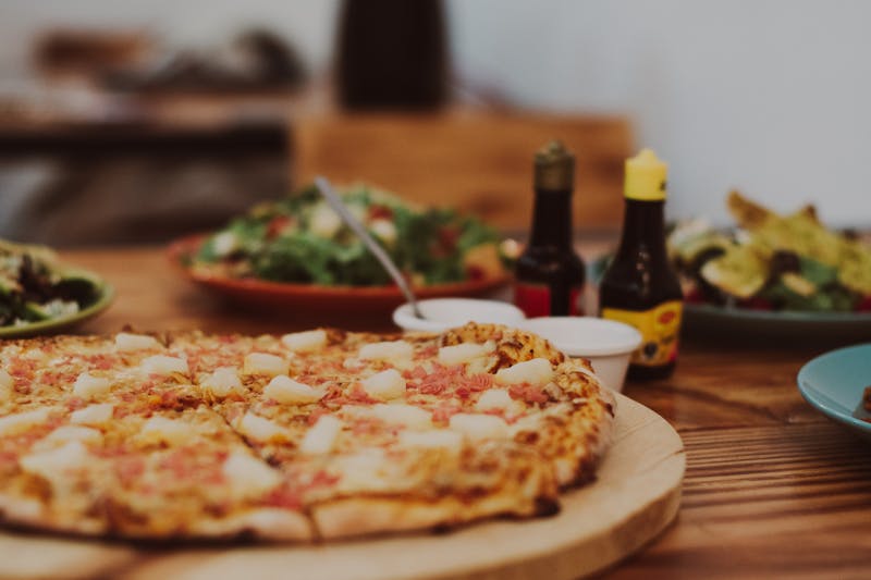 Hawaiian pizza with pineapple, ham and mozzarella